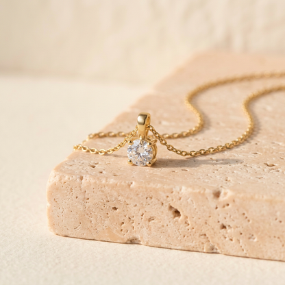 Solitaire pendant detail on peach stone