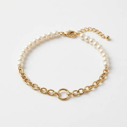 Pearl-style bead and gold-tone chain bracelet on white