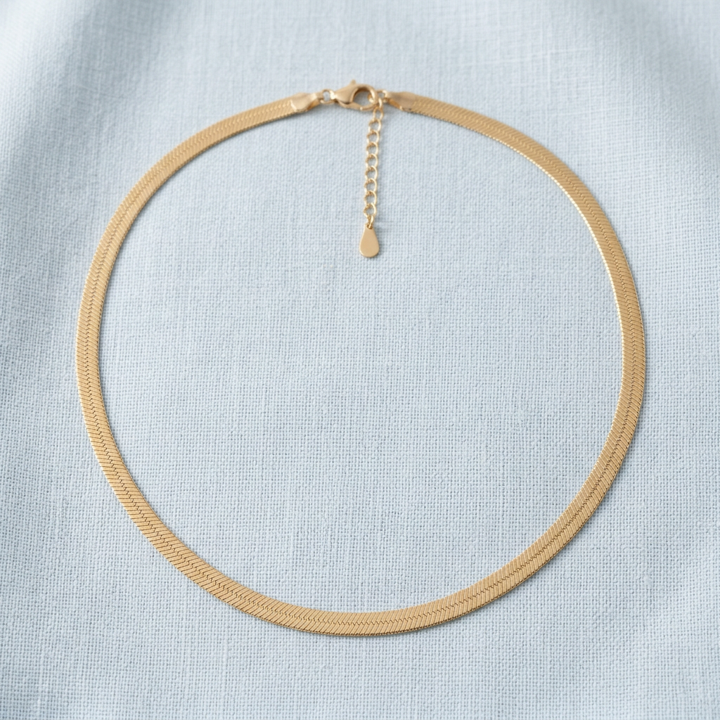 Herringbone necklace on pale blue linen