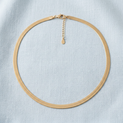 Herringbone necklace on pale blue linen