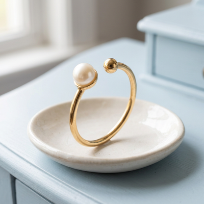 Open ring on ivory ceramic dish