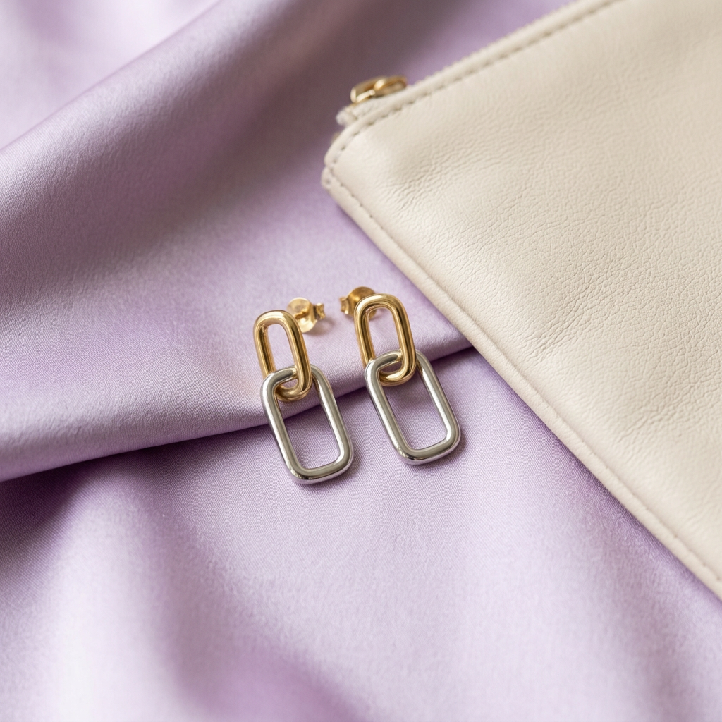 Rectangle link earrings styled on lavender satin