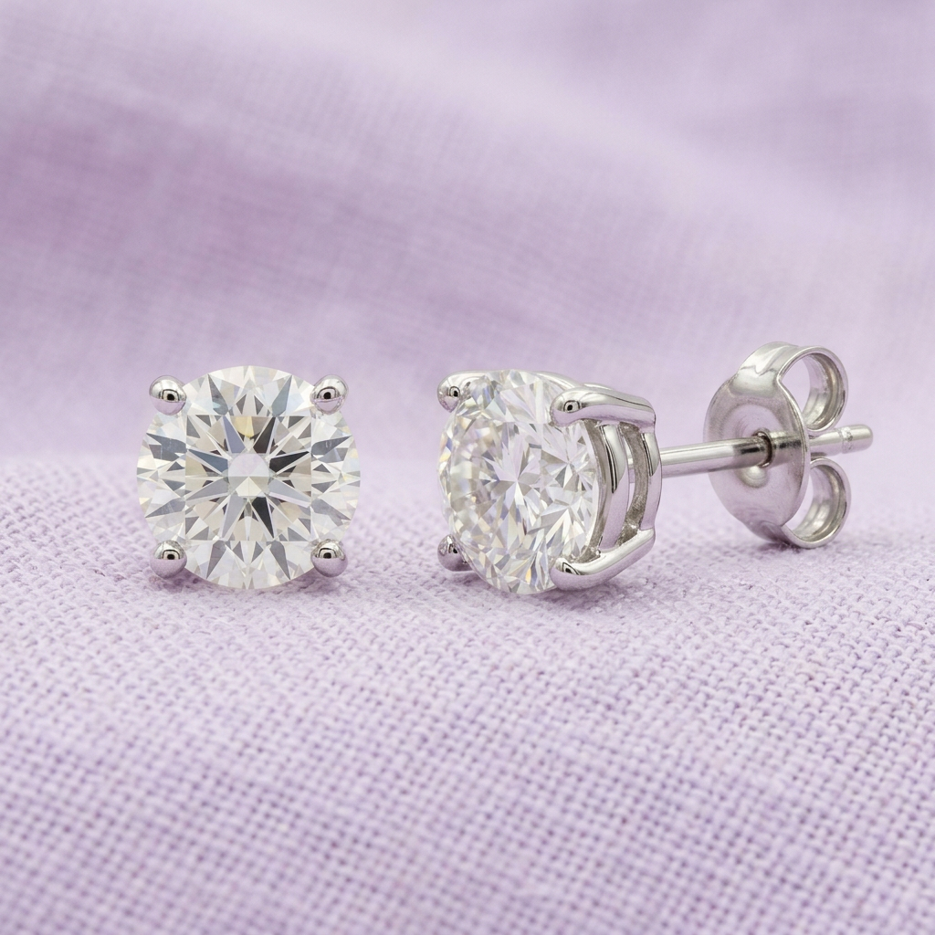 Solitaire stud pair on pale lavender linen