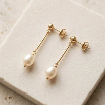 Creamy bead and gold-tone bar detail