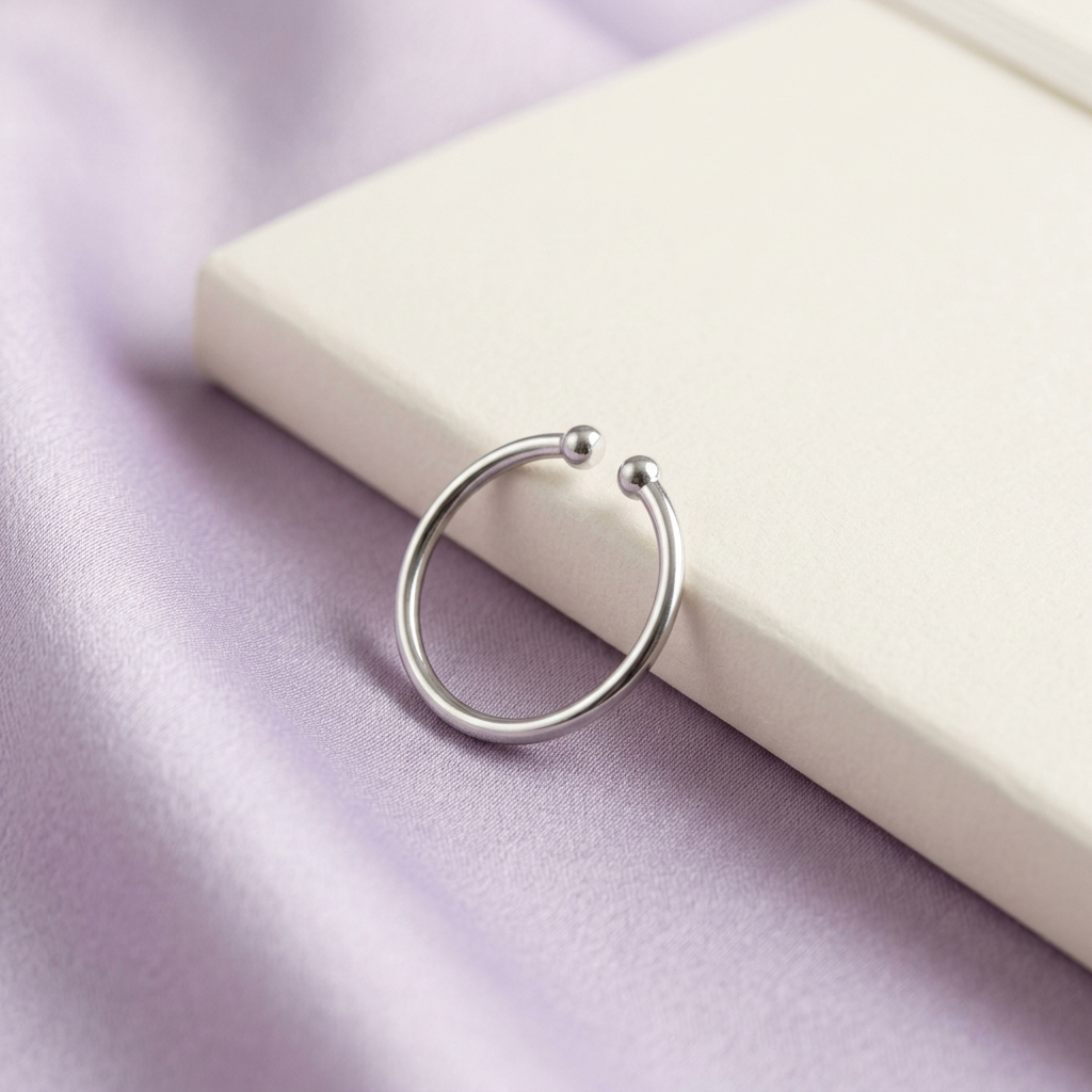 Minimalist ring styled on pale lavender satin