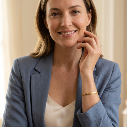 Western female model with face visible wearing cuff and dusty-blue blazer