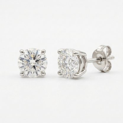 Round solitaire stud earring pair on white without material markings