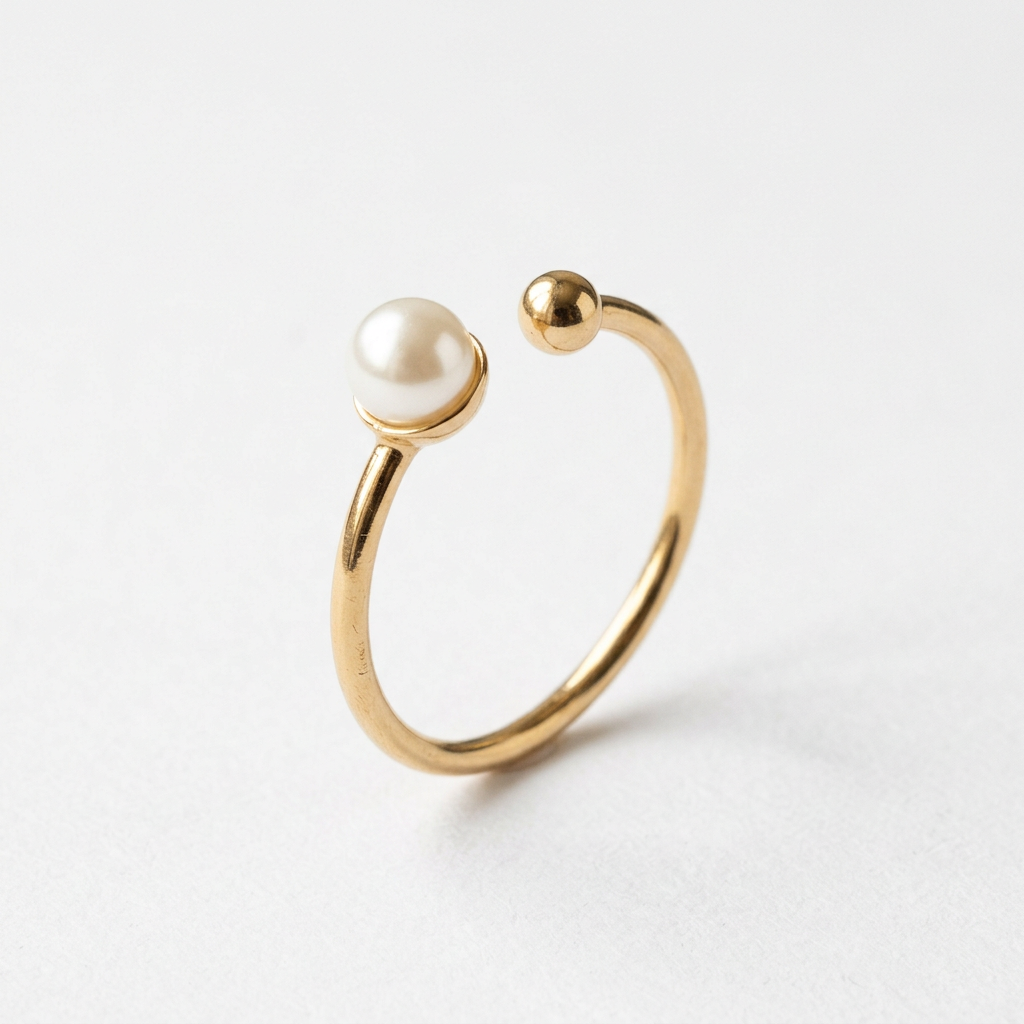 Pearl-style gold-tone open ring on white