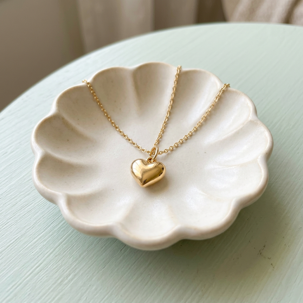Heart necklace on ivory ceramic dish